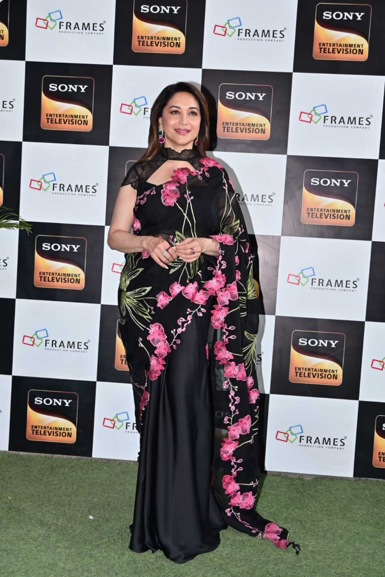 Madhuri Dixit arrived in a beautiful black saree to promote her upcoming film Maa Behen on the sets of India's Best Dancer. Madhuri Dixit arrived in a beautiful black saree to promote her upcoming film Maa Behen on the sets of India's Best Dancer.